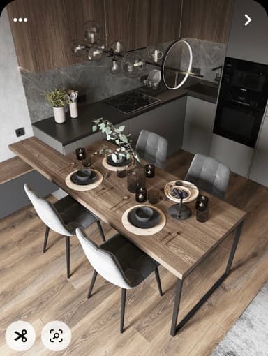 A rectangular dining table featuring a light brown wood-grain tabletop supported by two U-shaped black metal legs. The table is set with placemats, dark dishes, and decorative elements including a vase with greenery. — 3D model