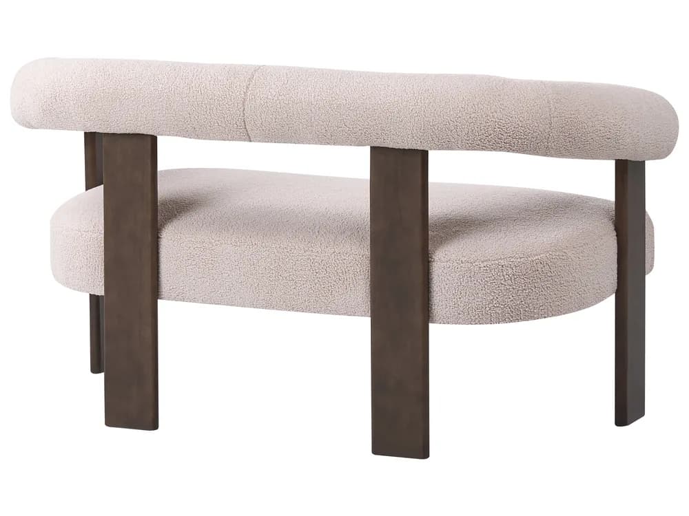 An armchair with a rounded, upholstered backrest and seat, supported by dark, rectangular metal legs. The upholstery appears to be a textured boucle fabric. The design features a clean, contemporary aesthetic with a distinctive curved top rail. — 3D model