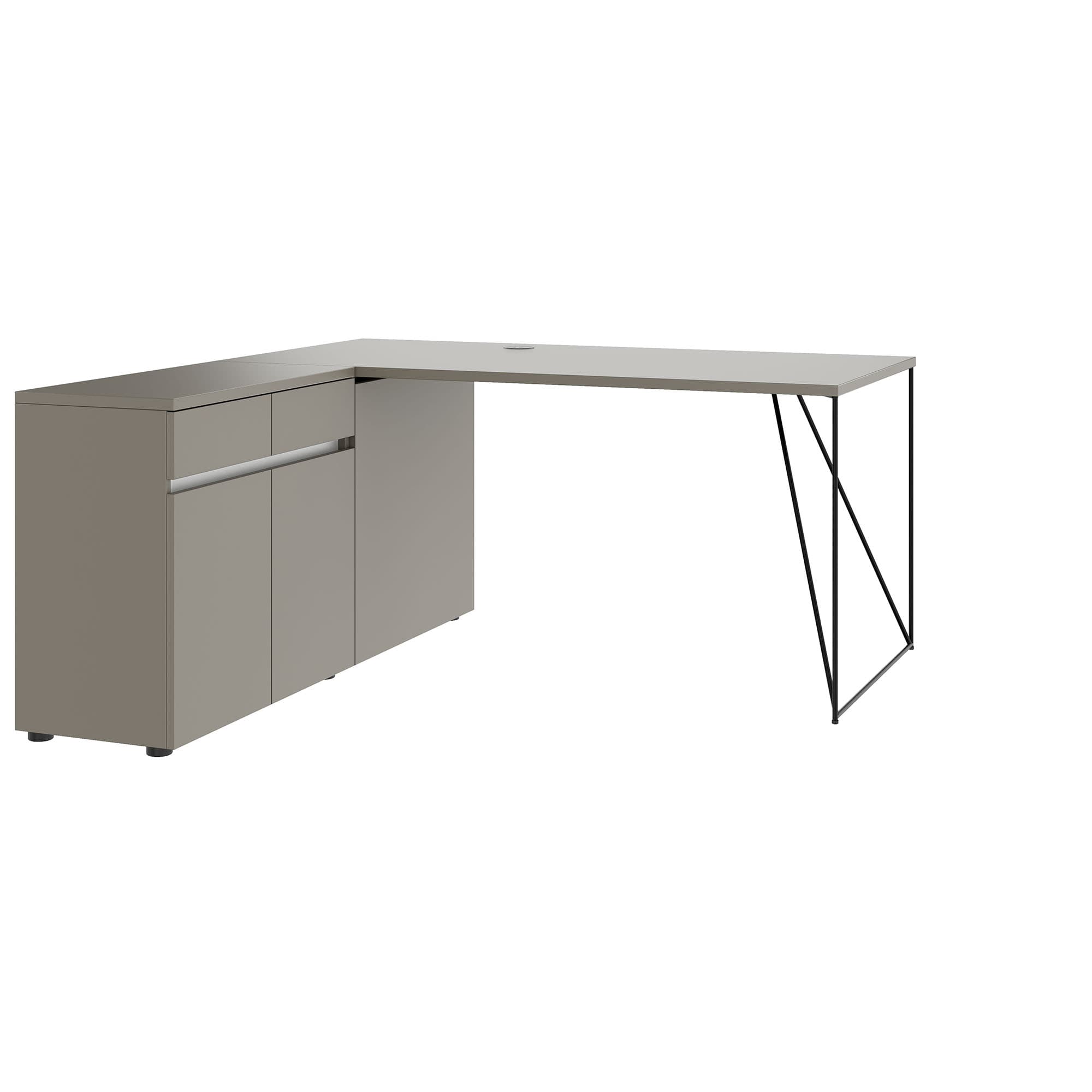A modern L-shaped desk with a taupe finish. The left section features two cabinet doors and a drawer with a horizontal brushed metal handle. The right section is supported by a minimalist black metal frame with an angular design. A circular cable management port is visible on the desktop. — 3D model