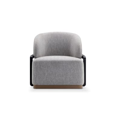 A contemporary armchair with a rounded back and upholstered seat and backrest. The armchair features black metal frame elements extending from the sides and a low wooden base. — 3D model