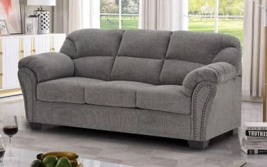 A grey upholstered three-seater sofa featuring rolled arms with nailhead trim and individual seat and back cushions. — 3D model
