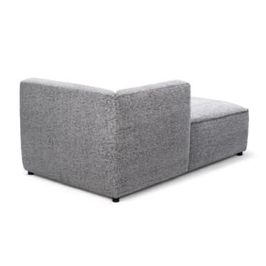 A modern, modular sofa section designed as a left-arm facing chaise lounge or corner piece. It features a low profile, blocky base, and a wrap-around back and armrest that curves gently on the left side. The upholstery is a textured, speckled fabric. — 3D model