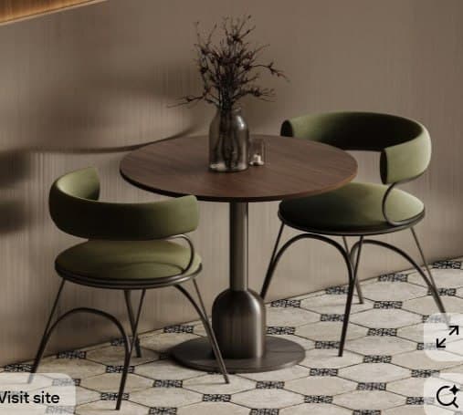 A contemporary dining set featuring a round dark wood tabletop, a brushed metal pedestal base, and two barrel-back dining chairs with olive green fabric upholstery and a minimalist metal frame. — 3D model