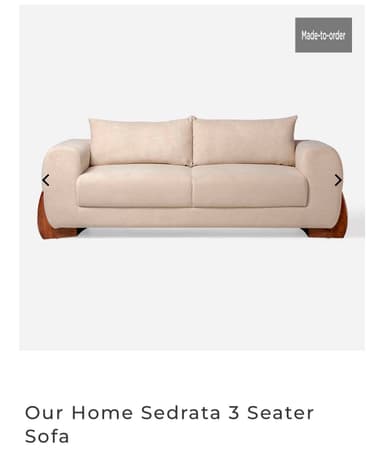 A modern two-seater sofa featuring light beige fabric upholstery and distinctive dark wood paneling on the base and exterior of the armrests, creating a sophisticated contrast. — 3D model