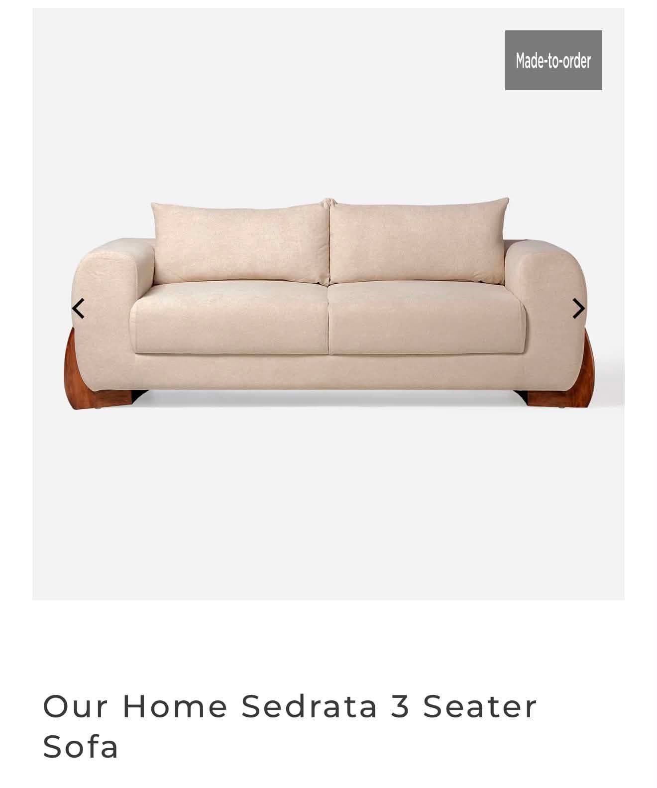 A modern two-seater sofa featuring light beige fabric upholstery and distinctive dark wood paneling on the base and exterior of the armrests, creating a sophisticated contrast. — 3D model