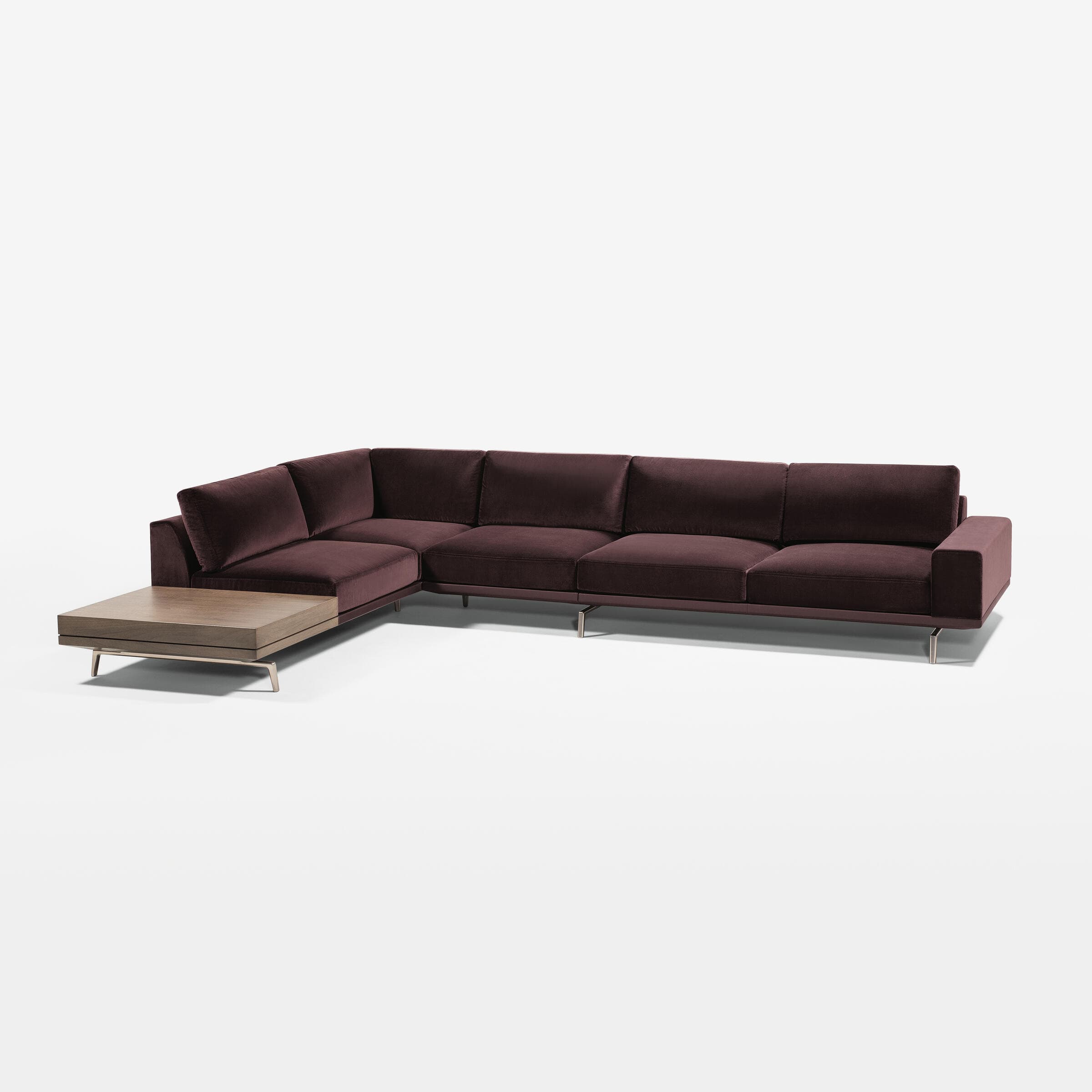 A contemporary L-shaped modular sectional sofa upholstered in deep maroon velvet fabric, featuring a low profile, sleek metal legs, and an integrated wooden end table. — 3D model