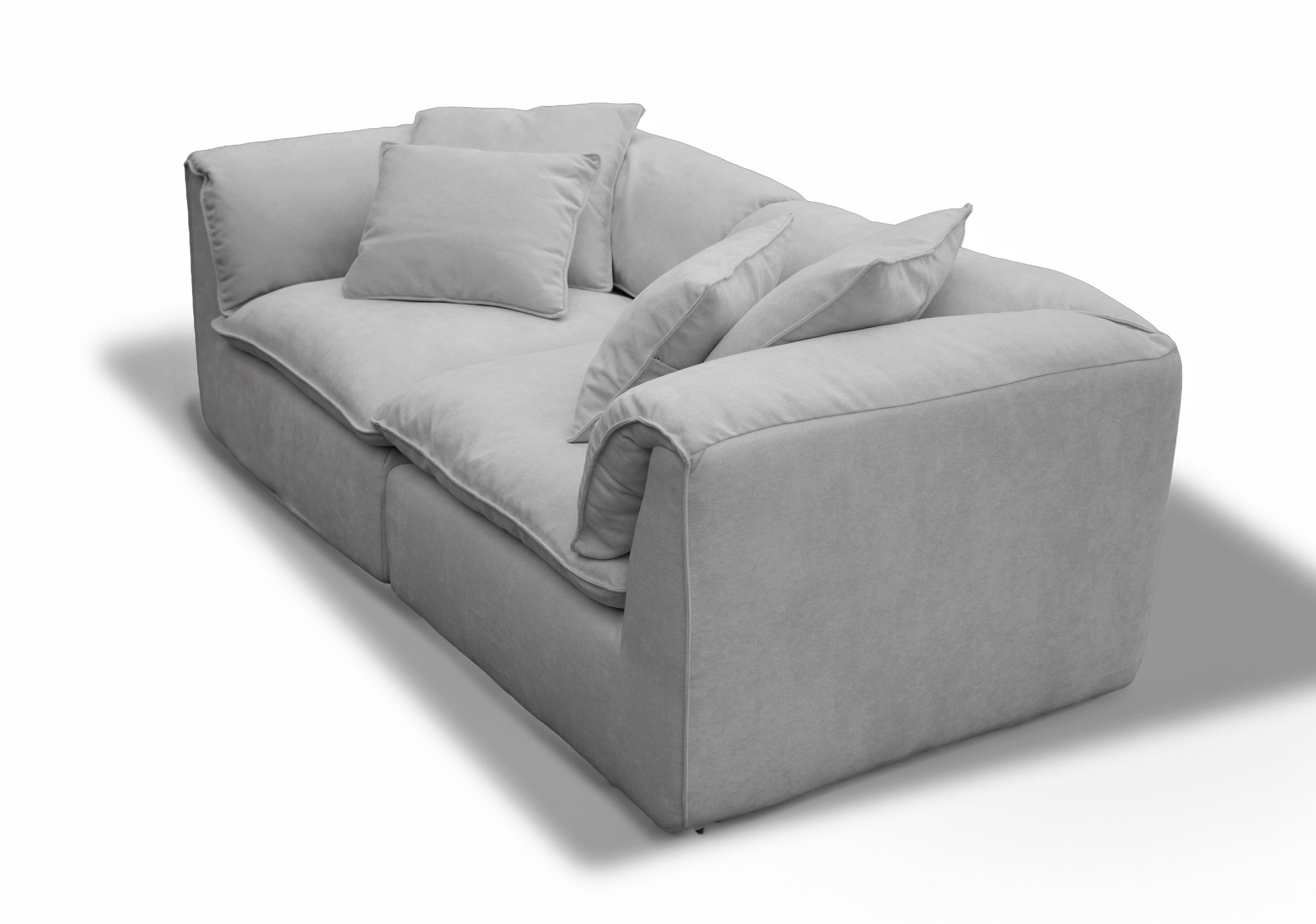 A contemporary deep-seated sofa, upholstered in a light gray textured fabric, featuring plush, loose seat and back cushions for maximum comfort. The design includes additional throw pillows and boasts a clean, monolithic silhouette with fully upholstered arms and base. — 3D model