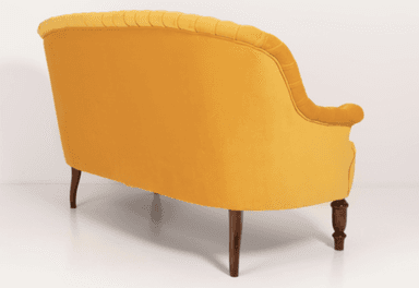 A traditional style armchair upholstered in a rich yellow velvet fabric. The chair features distinct rolled arms and a rolled crest rail on the backrest. It has four wooden legs, with a visibly turned leg at the front and a tapered leg at the rear. — 3D model
