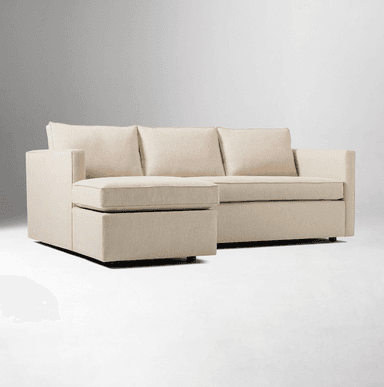 A contemporary sectional sofa upholstered in a light beige woven fabric, featuring a right-hand facing chaise lounge, low square arms, and loose back and seat cushions with tailored piping. — 3D model