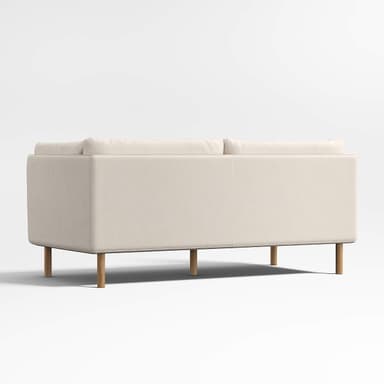 A two-seater sofa with clean lines and a minimalist design. It features a low profile, squared armrests, and plush cushions for the seat and back. The sofa is elevated by four slender, cylindrical wooden legs. — 3D model