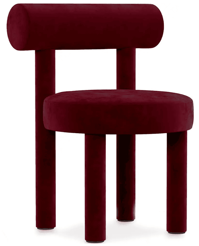 A contemporary accent chair upholstered in a deep red velvet fabric. The chair features a cylindrical backrest that extends to form vertical supports for the seat. The seat itself is circular and cushioned. The base consists of four cylindrical legs, also upholstered in the same red velvet, splayed slightly outward. — 3D model