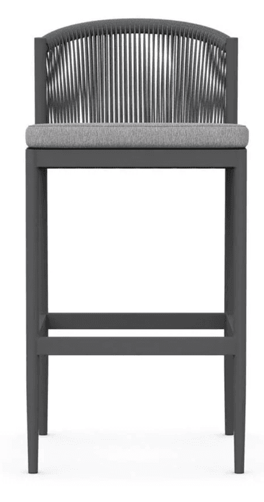A contemporary bar stool featuring a dark grey aluminum frame, a backrest crafted from tightly woven dark grey rope, and a light grey upholstered seat cushion. It includes an integrated footrest. — 3D model
