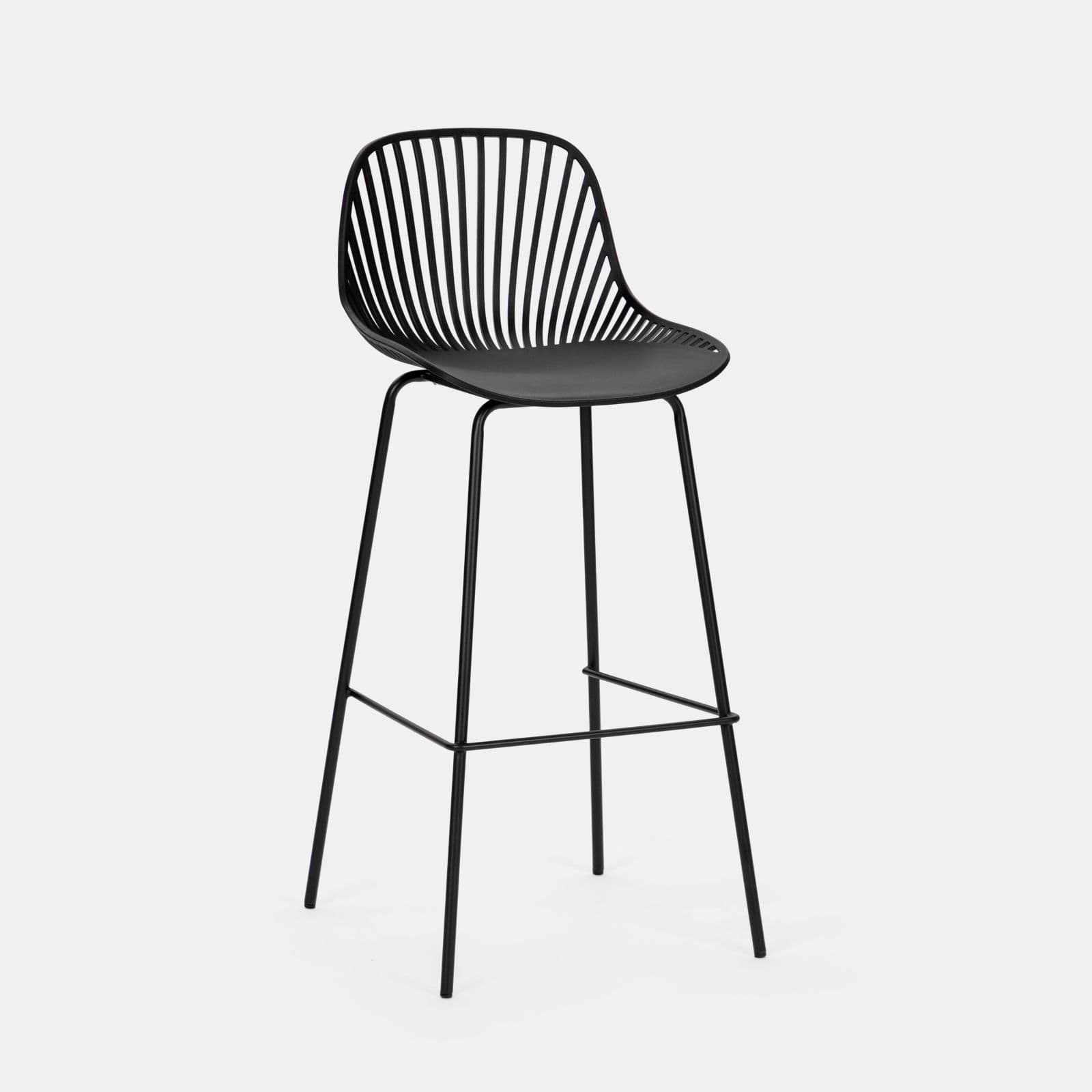 A modern black bar stool with a distinctive design. The seat and backrest are formed by a molded, curved shell with a matte finish, accented by numerous thin, vertical slats that create a semi-transparent effect. The seat itself appears solid and slightly concave for comfort. It is supported by a slender, black metal frame consisting of four legs that are angled outwards for stability, connected by a circular footrest. The overall aesthetic is minimalist and contemporary. — 3D model