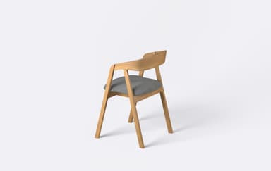 A modern dining armchair featuring a light-toned wooden frame and a grey upholstered seat. The backrest is crafted from bentwood, forming a continuous curve that extends into integrated armrests. The chair is presented against a plain white background, highlighting its clean lines and minimalist design. — 3D model