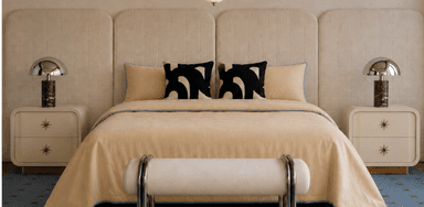 A complete contemporary bedroom set featuring a platform bed, a wide upholstered panel headboard, two integrated bedside tables, two table lamps, and a matching upholstered bench. The set is primarily beige/cream with metallic accents. — 3D model