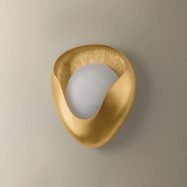 A modern, sculptural wall sconce featuring an abstract, organic shape with a textured gold finish, partially enclosing a spherical, frosted white light diffuser. — 3D model