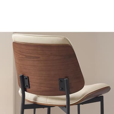 A dining chair with a curved, padded seat and backrest. The seat and backrest appear to be upholstered in a light-colored faux leather with decorative stitching. The chair has a thin wooden trim around the seat and backrest, and black metal legs. Dimensions are indicated for the backrest height (15.15 inches) and seat width (19.69 inches). — 3D model