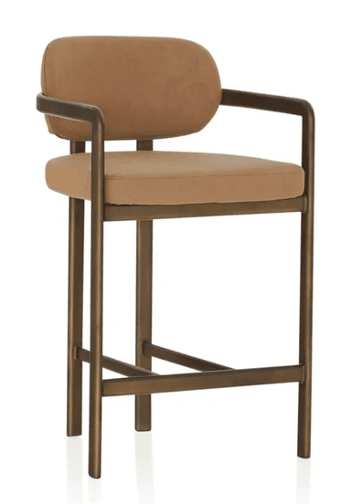 A contemporary bar stool featuring a sturdy metal frame with a bronzed finish, complemented by a padded seat and a gently curved backrest, both upholstered in a light brown fabric. The design includes integrated armrests and a footrest bar for comfort. — 3D model