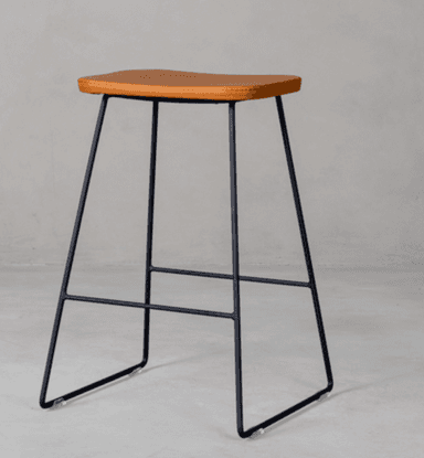 A modern bar stool featuring a rectangular, saddle-shaped seat upholstered in brown faux leather, supported by a minimalist black metal frame with integrated footrests. — 3D model