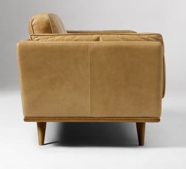 A three-seater sofa with a low profile and square arms. The sofa features upholstered cushions for the back and seat, with piping detail along the edges. It is supported by a wooden frame with tapered legs. — 3D model