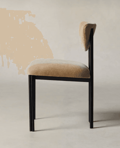 A modern dining chair featuring a matte black tubular metal frame and beige upholstered seat and sculpted backrest. — 3D model