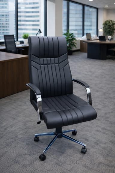A black executive office chair with a high back, upholstered in faux leather, featuring vertical channel tufting, chrome-plated armrests with padded tops, and a five-star chrome base with casters. — 3D model