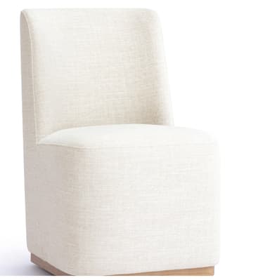 An armless, fully upholstered modern chair with a low back and a solid block-like base, featuring a light-toned textured fabric and a natural wood plinth. — 3D model