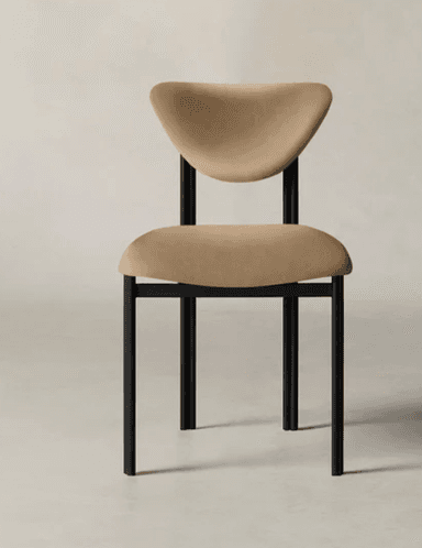 A modern dining chair featuring a matte black tubular metal frame and beige upholstered seat and sculpted backrest. — 3D model