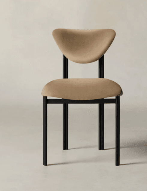 A modern dining chair featuring a matte black tubular metal frame and beige upholstered seat and sculpted backrest. — 3D model
