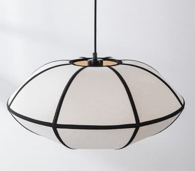 A close-up view of the underside of a fabric chandelier. The shade is constructed from light-colored, textured fabric panels, divided by dark, possibly black, binding or trim. The panels create a somewhat spherical or drum-like shape. An exposed incandescent light bulb is visible through a central opening at the bottom, with internal support structures for the shade also discernible. — 3D model