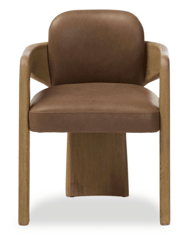 A contemporary armchair featuring a solid wood frame, likely oak, with a light brown finish and visible grain. The design includes a deeply curved backrest that gracefully extends to form integrated armrests. A plush brown leather or faux leather upholstery is visible on the seat and inner backrest, providing a contrast to the natural wood. The chair's legs are sturdy and straight, complementing the clean lines of the design. The overall aesthetic is modern, sculptural, and organic. — 3D model