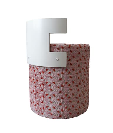 A contemporary cylindrical stool featuring a pink and red geometric patterned upholstery and a distinctive T-shaped white backrest. The base is fully upholstered with a textured fabric, while the backrest provides a clean, minimalist contrast in a solid color. — 3D model