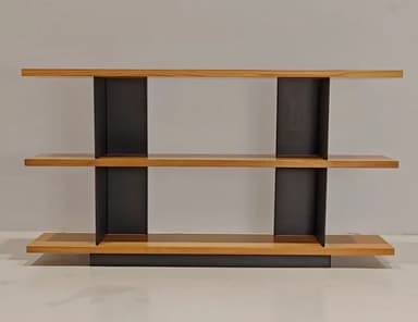 A modern, multi-tiered console table featuring three horizontal wooden shelves supported by contrasting vertical black elements. The top shelf extends over the middle, which in turn extends over the base, creating a cantilevered and layered appearance. The black supports are angled, providing a geometric and stable structure. — 3D model