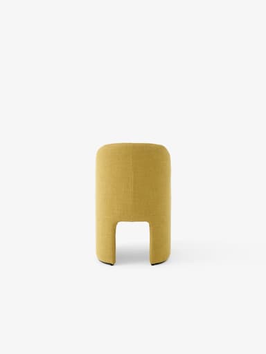 A modern armchair with a curved backrest and seat upholstered in textured mustard-yellow fabric. The backrest features vertical channel tufting. The base is formed by two curved, solid panels that create a sled-like effect, with a thin black element visible at the bottom of each panel. — 3D model