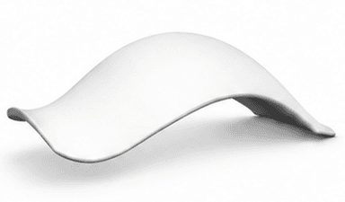 A contemporary bench with a flowing, organic design. The bench has a smooth, curved surface that appears to be made from a single piece of material, creating a seamless and minimalist aesthetic. It is presented in a studio setting against a plain white background. — 3D model