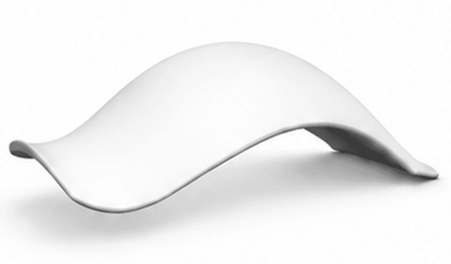 A contemporary bench with a flowing, organic design. The bench has a smooth, curved surface that appears to be made from a single piece of material, creating a seamless and minimalist aesthetic. It is presented in a studio setting against a plain white background. — 3D model
