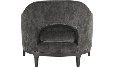 A contemporary armchair with a rounded, barrel-shaped back and a deep seat. The upholstery features a subtle geometric pattern. The chair is supported by a dark wooden base and four tapered legs. — 3D model