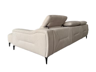 A light gray sectional sofa with a chaise lounge extension. The sofa features plush cushions and a modern design with angular armrests and subtly decorative stitching on the sides. It is supported by slender, dark-colored legs. — 3D model