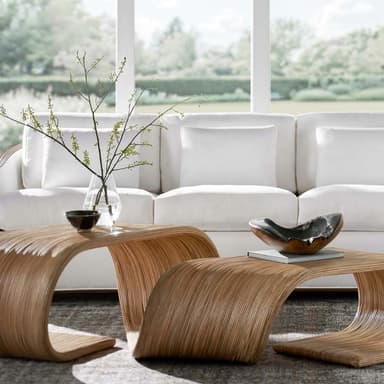 A minimalist side table or stool constructed from a single continuous piece of bent plywood, showcasing a natural light wood grain finish. — 3D model