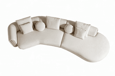 A large, curved sectional sofa upholstered in a light, textured boucle fabric, featuring a left-hand chaise extension and a unique right-hand armrest with a recessed wooden panel. The sofa includes several matching decorative pillows, both square and round. — 3D model