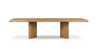 A modern rectangular dining table crafted from light-colored solid wood, likely oak, featuring a thick tabletop with softened edges supported by two prominent, rectangular pedestal bases. — 3D model