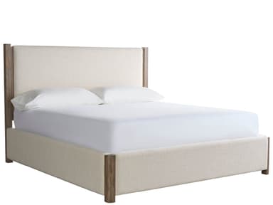 A modern platform bed featuring an upholstered headboard and side rails in a light, neutral fabric, accented by exposed vertical wooden posts at each corner. The bed is shown with a white mattress and pillows, indicating it is designed for a minimalist and contemporary bedroom setting. — 3D model