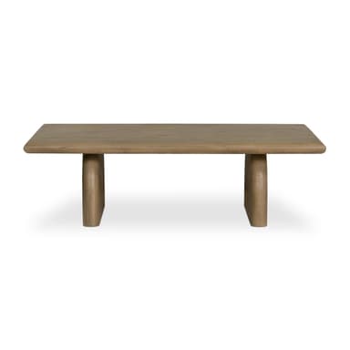 A low rectangular coffee table with a thick, rounded top and two sturdy, cylindrical legs positioned towards the ends of the table. The piece has a minimalist design and appears to be made from solid wood. — 3D model