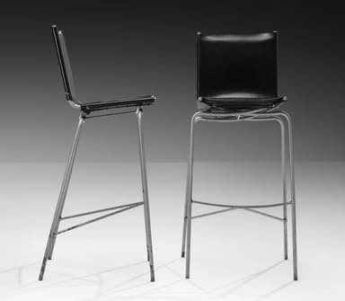 A bar stool with a black seat and backrest, supported by a thin, metallic frame with four legs connected by a crossbar for stability. The seat appears to be upholstered. — 3D model