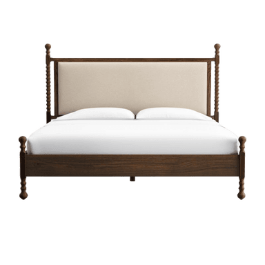 A dark-stained wooden bed frame featuring an upholstered headboard. The headboard and footboard both incorporate turned posts, with the headboard posts being taller and having a distinctive reeded or spiraled detail. The upholstered panel is a light, neutral-toned fabric. — 3D model
