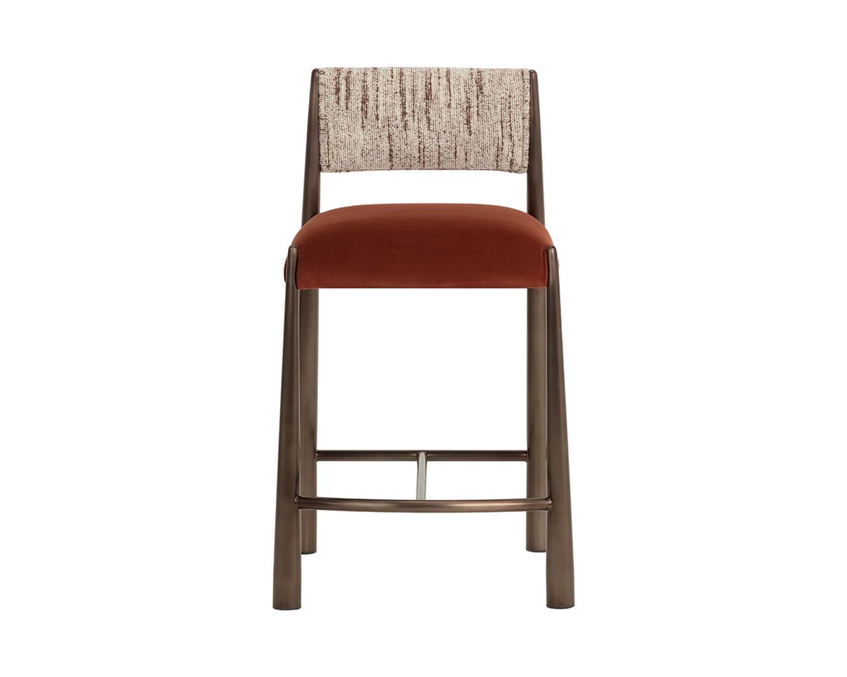 A modern bar stool with a tall backrest and a cushioned seat. The frame is constructed from metal with a brushed finish. The seat is upholstered in a dark rust-colored velvet fabric. The backrest features a distinct textile pattern in light beige and brown tones. — 3D model