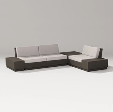 A modern sectional sofa composed of multiple modular units. The base and armrests are constructed from dark-colored material, forming a cohesive and blocky structure. The seating and back cushions are upholstered in a light, neutral fabric, providing a contrast to the darker frame. The configuration suggests an L-shaped arrangement, suitable for contemporary living spaces or outdoor patios. — 3D model