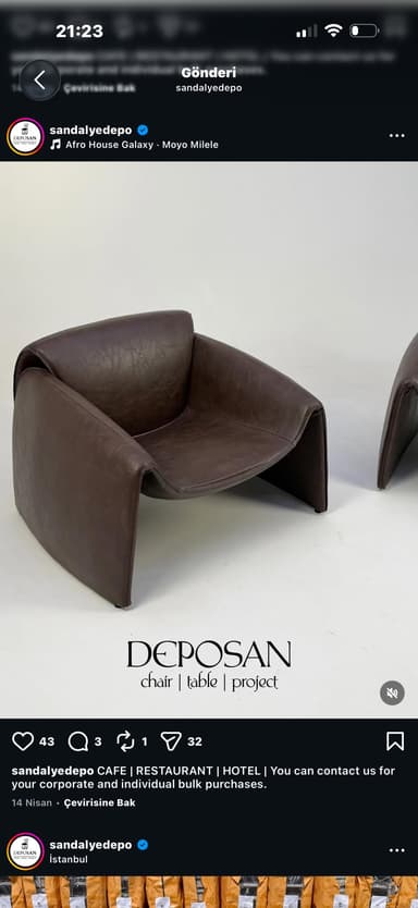 A contemporary lounge chair with a continuous, sculptural form, upholstered in dark brown leather. — 3D model