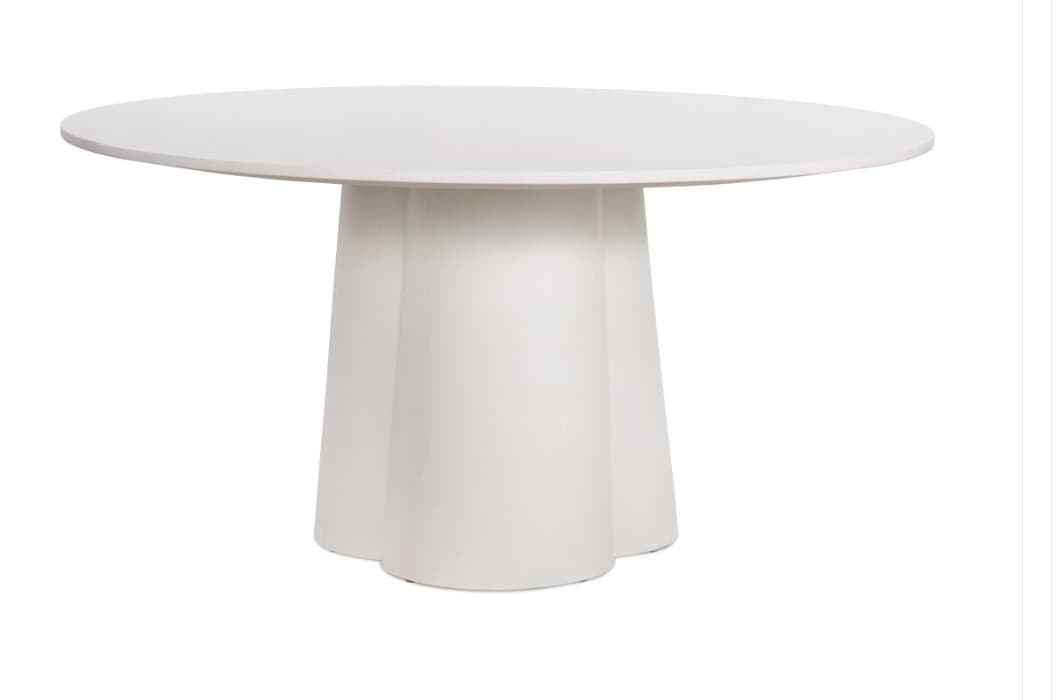 A contemporary round dining table featuring a smooth, white finish. The tabletop is circular and rests upon a substantial, sculptural pedestal base. The base has a fluted or petal-like design, tapering slightly from the top and flaring out at the bottom to provide stable support. — 3D model