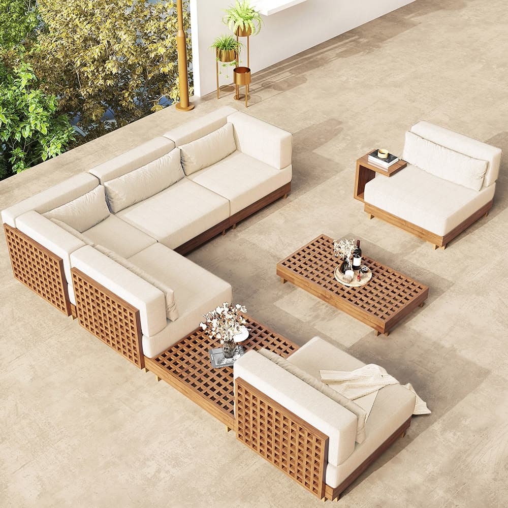 A modular outdoor sofa set featuring a sectional sofa, an armless chair, and a coffee table. The furniture pieces have a modern design with light-colored upholstered cushions and a slatted wooden base and frame. The coffee table also features a slatted wooden surface. The sectional sofa is configured in an L-shape. — 3D model